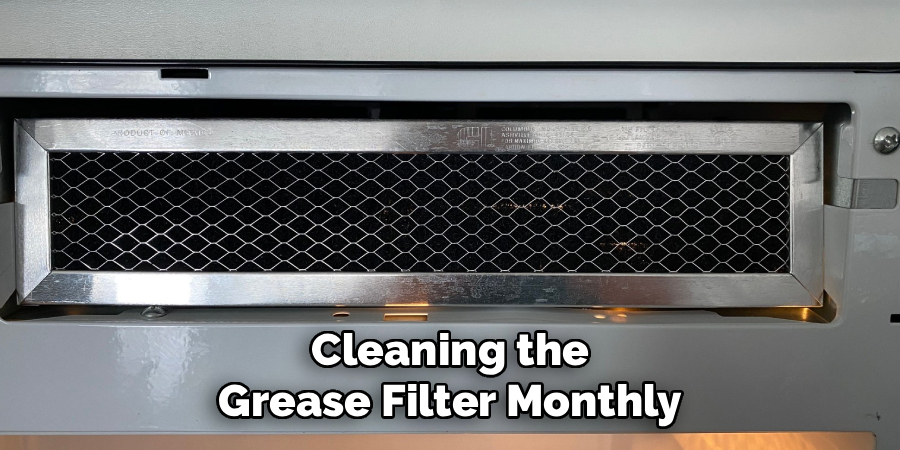Cleaning the
Grease Filter Monthly